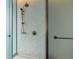 Modern shower with marble tile and dual shower heads at 1000 Water St # 1103, Tampa, FL 33602