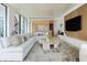 Open concept living room with city views and kitchen at 1000 Water St # 1103, Tampa, FL 33602