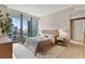 Bright bedroom featuring a king-size bed and city views at 1000 Water St # 1103, Tampa, FL 33602