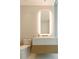 Elegant bathroom with a floating vanity, illuminated mirror, and modern toilet at 1000 Water St # 1103, Tampa, FL 33602
