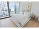 Bright bedroom with a king-size bed and city views at 1000 Water St # 1103, Tampa, FL 33602