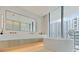 Modern bathroom with a freestanding tub and double vanity at 1000 Water St # 1103, Tampa, FL 33602