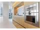 Modern kitchen with stainless steel appliances and light wood cabinets at 1000 Water St # 1103, Tampa, FL 33602