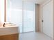 Modern bathroom with floating vanity and large window at 1000 Water St # 1103, Tampa, FL 33602