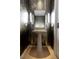 Elegant powder room with bamboo wallpaper and pedestal sink at 1000 Water St # 1103, Tampa, FL 33602