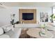 Living room with white sofa and wood wall at 1000 Water St # 1103, Tampa, FL 33602