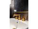 Close up of modern gold faucet and sink at 1000 Water St # 1103, Tampa, FL 33602
