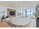 Luxury living room with curved sofa and city views at 1000 Water St # 1103, Tampa, FL 33602