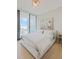 Bright bedroom with a king-size bed and city views at 1000 Water St # 1103, Tampa, FL 33602