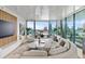 Spacious living room with city views and curved sofa at 1000 Water St # 1103, Tampa, FL 33602