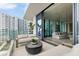 Modern balcony with glass doors opening to living area and city views at 1000 Water St # 1103, Tampa, FL 33602
