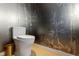 Modern powder room with bamboo wallpaper and toilet at 1000 Water St # 1103, Tampa, FL 33602