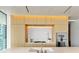 Modern kitchen with light wood cabinets and marble backsplash at 1000 Water St # 1103, Tampa, FL 33602