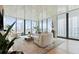 Living room boasts city views and curved sofa at 1000 Water St # 1103, Tampa, FL 33602