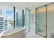 Spa-like bathroom with soaking tub and city views at 1000 Water St # 1103, Tampa, FL 33602