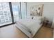 Bright bedroom with a king-size bed and city views at 1000 Water St # 1103, Tampa, FL 33602