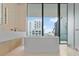 Luxury bathroom with a freestanding tub and city views at 1000 Water St # 1103, Tampa, FL 33602