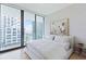 Bright bedroom with a king-size bed and city views at 1000 Water St # 1103, Tampa, FL 33602