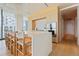 Modern kitchen with marble island, light wood cabinets, and high-end appliances at 1000 Water St # 1103, Tampa, FL 33602