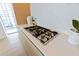 Modern kitchen with gas cooktop and marble backsplash at 1000 Water St # 1103, Tampa, FL 33602