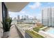 Relaxing balcony showcasing a stunning city view and pool at 1000 Water St # 1103, Tampa, FL 33602