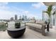 Spacious balcony with city views, comfortable seating, and modern decor at 1000 Water St # 1103, Tampa, FL 33602