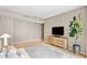 Serene bedroom with light wood accents and city views at 1000 Water St # 1103, Tampa, FL 33602