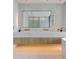 Double vanity bathroom with modern lighting and fixtures at 1000 Water St # 1103, Tampa, FL 33602