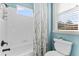 Clean bathroom with a shower/tub combo and window at 10412 Carroll Cove Pl, Tampa, FL 33612