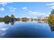 Serene waterfront view showcasing the calm waters and neighboring houses at 10412 Carroll Cove Pl, Tampa, FL 33612