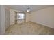 Bedroom featuring a ceiling fan and ample closet space at 1630 Woodmar Dr, Sun City Center, FL 33573