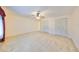 Spacious bedroom with ceiling fan and large closets at 1630 Woodmar Dr, Sun City Center, FL 33573