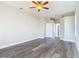 Spacious bedroom with ceiling fan and wood-look floors at 1420 Nimbus Dr, North Port, FL 34287