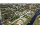 Aerial view of the neighborhood with houses and waterways at 1420 Nimbus Dr, North Port, FL 34287