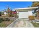 Front view of house with garage and American flag at 526 Normandy Rd, Madeira Beach, FL 33708