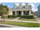 Two-story Craftsman home with front porch and landscaping at 32746 Coldwater Creek Loop, Wesley Chapel, FL 33545