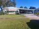 Cozy ranch home with carport and well-maintained lawn at 225 Lake Tarpon Dr # 22, Palm Harbor, FL 34684