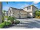 Two-story house with stone accents and three-car garage at 824 Manns Harbor Dr, Apollo Beach, FL 33572