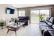 Bright living room with sliding glass doors and patio access at 7518 Lyncrest St, North Port, FL 34287