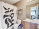 Clean bathroom with a shower/tub combo, toilet, and vanity at 7518 Lyncrest St, North Port, FL 34287