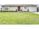 Charming single story home with well-maintained lawn at 7518 Lyncrest St, North Port, FL 34287