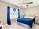 Bright bedroom with a queen-size bed and large window at 7518 Lyncrest St, North Port, FL 34287