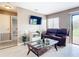 Spacious living area with comfortable seating and a large TV at 7518 Lyncrest St, North Port, FL 34287