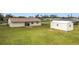 Large backyard with shed and plenty of green space at 7518 Lyncrest St, North Port, FL 34287