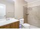 Clean bathroom with shower and modern vanity at 7518 Lyncrest St, North Port, FL 34287