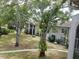 Apartment building complex with mature trees and landscaped grounds at 2625 State Road 590 # 2412, Clearwater, FL 33759