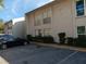 Apartment building exterior, featuring ample parking and landscaping at 2625 State Road 590 # 2412, Clearwater, FL 33759