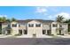 Townhouse-style building with four units, each featuring a garage at 11444 Crescent Deer Dr, Land O Lakes, FL 34638