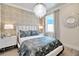 Bedroom with unique wallpaper and comfortable bed at 31879 Anchor Point Dr, Wesley Chapel, FL 33545