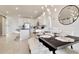Open concept dining area with kitchen view at 31879 Anchor Point Dr, Wesley Chapel, FL 33545